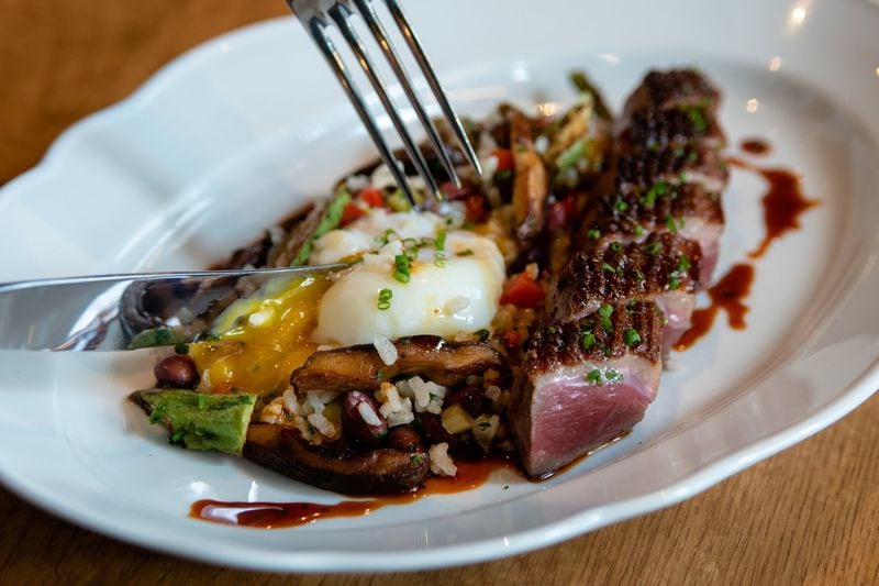 An entree that might catch your eye at Achie’s is the duck breast with toasted rice, boiled peanut hoppin’ John, okra, shiitake mushrooms and a soft-boiled egg. CONTRIBUTED BY HENRI HOLLIS