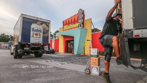 Hours after a man was shot inside Midtown Bowl early Friday, Lonnie Blackman with Empire Distributors unloaded supplies outside the Piedmont Circle bowling alley.