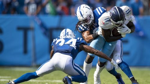 A.J. Brown of the Tennessee Titans is wrapped up by Clayton Geathers (26) and Rock Ya-Sin (34) of the Indianapolis Colts during the fourth quarter at Nissan Stadium on September 15, 2019 in Nashville, Tennessee. Indianapolis defeats Tennessee 19-17.  (Photo by Brett Carlsen/Getty Images)