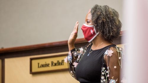 Tarece Johnson is sworn in to the Gwinnett County Board of Education on Dec. 17, 2020. Johnson was elected board chair for 2022.  (Jenni Girtman for The Atlanta Journal-Constitution)