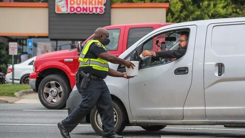 A Suwanee Dunkin' paid back wages for denying an employee sick leave. (John Spink / John.Spink@ajc.com) AJC FILE PHOTO