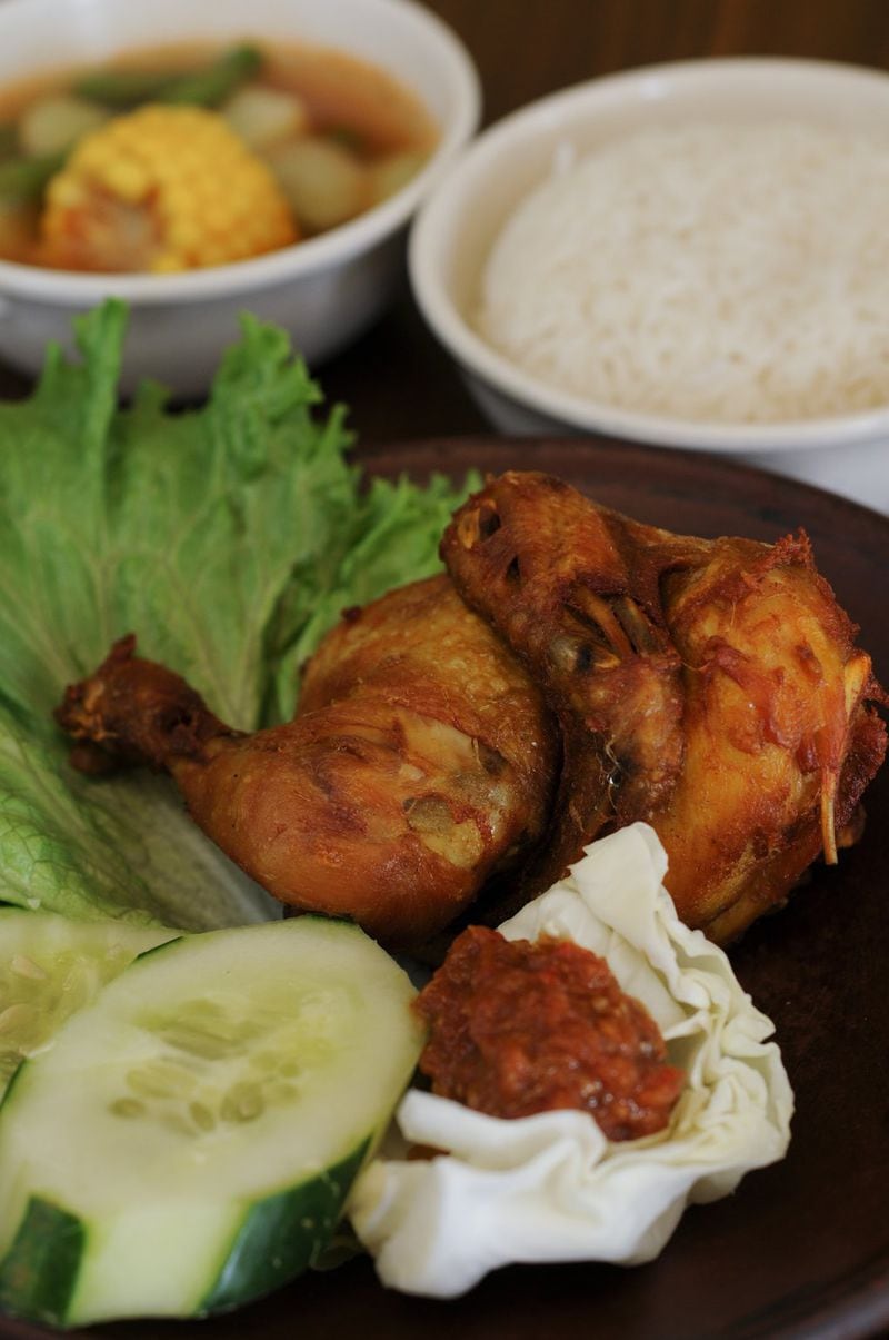 Ayam penyet, which literally means “smashed chicken,” is a great introduction to Indonesian cuisine at Tempo Doeloe in Doraville. CONTRIBUTED BY BECKY STEIN / SPECIAL