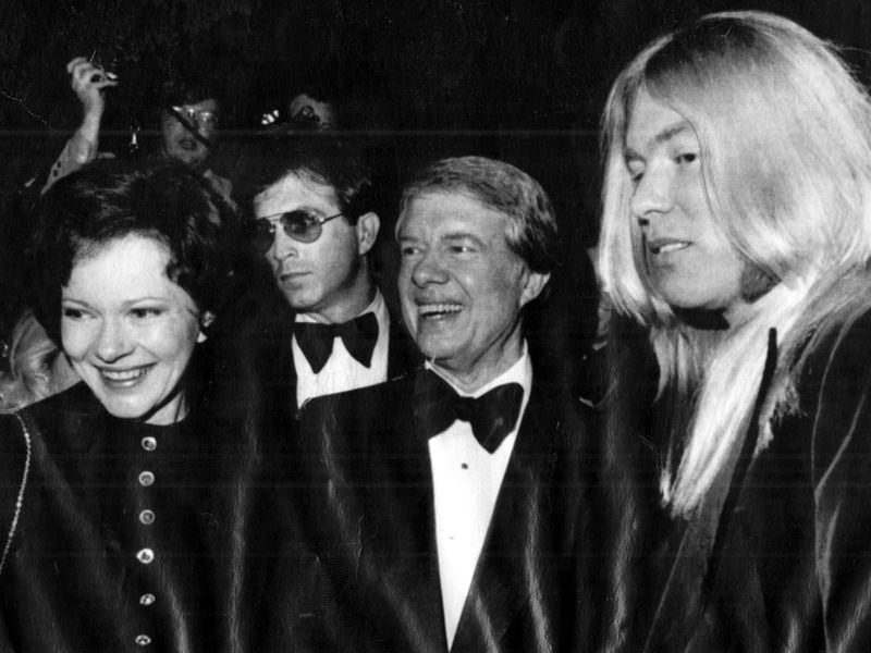 Then President-elect Jimmy Carter and wife Rosalynn greet an old friend at a gala in 1977. Rock musician Gregg Allman (right) was one of the performers at the Kennedy Center show. (Associated Press)