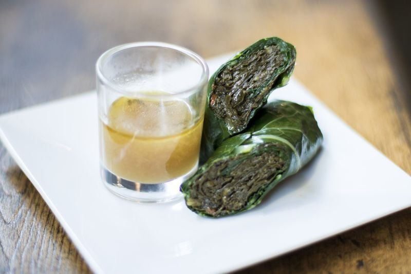 Twisted Soul’s signature dish is a collard roll—a mix of braised greens wrapped in a blanched collard leaf. Photo credit: Haemo Ku