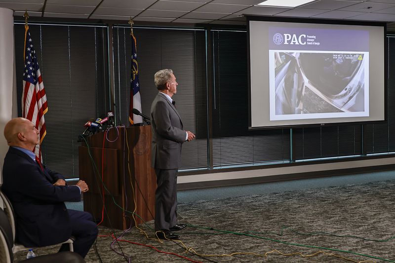 Former Gwinnett District Attorney Daniel J. Porter (right) and Prosecuting Attorneys’ Council of Georgia Executive Director Peter J. Skandalakis (left) discuss video evidence during a press conference announcing the charging decision in the Rayshard Brooks case on Tuesday, August 23, 2022.

