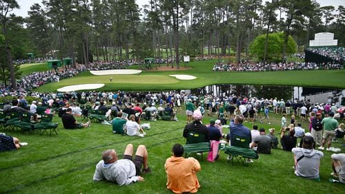 Patrons watch play on 16th green during the practice round of the 2024 Masters Tournament at Augusta National Golf Club, Tuesday, April 9, 2024, in Augusta. (Hyosub Shin / Hyosub.Shin@ajc.com)