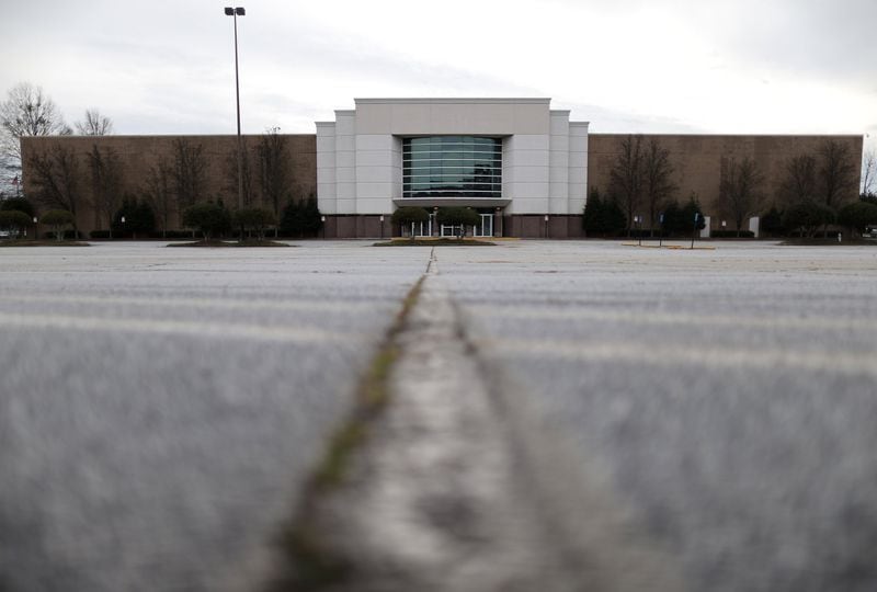 Thousands of empty parking spaces surround Gwinnett Place. The Duluth mall that has seen a sharp decline in shoppers and retailers. Ben Gray / bgray@ajc.com