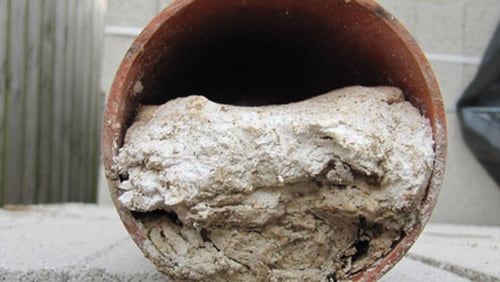 File photo depicts a DeKalb County sewer pipe clogged by paper towels and wipes. The city of Ball Ground reported more than $50,000 in damage to its sewer system caused by grease, shop towels and other foreign objects over the last three months. SPECIAL PHOTO / DEKALB COUNTY