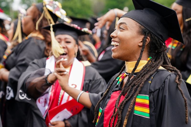 Students react to the announcement by Pinky Cole in her commencement address that she would gift and set up LLCs for every graduate at Clark Atlanta University’s commencement on Saturday, May 14, 2022, in Atlanta. (Elijah Nouvelage for The Atlanta Journal-Constitution)