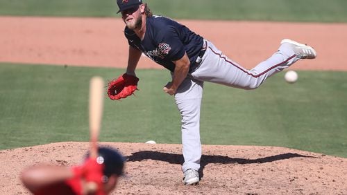 Atlanta Braves reliever A.J. Minter delivers against the Boston Red Sox during the fifth inning Monday, March 1, 2021, at JetBlue Park in Fort Myers, Fla. (Curtis Compton / Curtis.Compton@ajc.com)