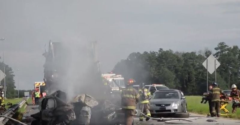 A tractor-trailer crashed into other vehicles Tuesday on I-16 in Macon, killing three people. (Credit: Macon Telegraph)