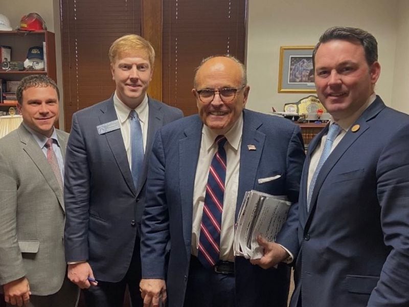 Rudy Giuliani is pictured at the Georgia Capitol in 2020 with then-state Sens. Tyler Harper, Blake Tillery and Burt Jones. Harper is now the state's Agriculture Commissioner, while Jones is lieutenant governor. (File photo)