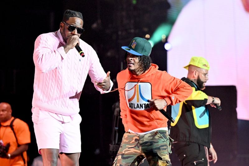 ATLANTA, GEORGIA - MAY 12: Young Dro and T.I. perform onstage during the Strength of a Woman's MJB “Celebrating Hip Hop 50” Concert in Partnership with Mary J. Blige, Pepsi, and Live Nation Urban at State Farm Arena on May 12, 2023 in Atlanta, Georgia. (Photo by Paras Griffin/Getty Images for Strength Of A Woman Festival & Summit)