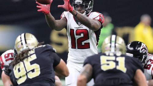 Falcons wide receiver Mohamed Sanu takes a snap at quarterback against the Saints during the second half in a NFL football game on Sunday, December 24, 2017, in New Orleans.