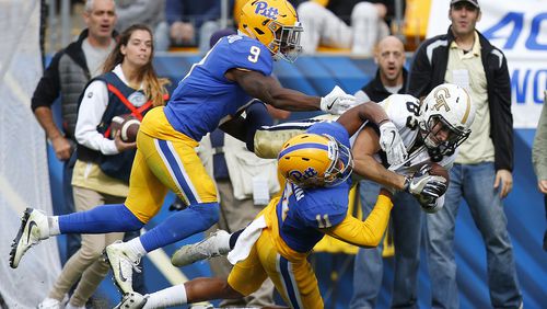 Brad Stewart #83 of the Georgia Tech Yellow Jackets pulls in the pass against Dane Jackson #11 and Jordan Whitehead #9 of the Pittsburgh Panthers in the second half on October 8, 2016 at Heinz Field in Pittsburgh, Pennsylvania. (Photo by Justin K. Aller/Getty Images)