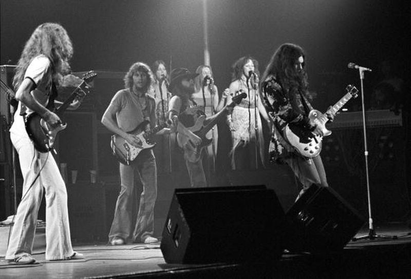 ATLANTA, GA - July 10: Guitarist Allen Collins, guitarist Steve Gaines, bassist Leon Wilkeson, The Honkettes and guitaraist Gary Rossington of Lynyrd Skynyrd perform at the Fabulous Fox Theater on July 10, 1976 in Atlanta, Georgia. (Photo by Tom Hill/WireImage)