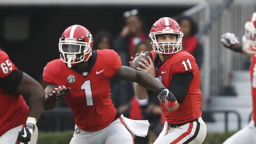 Georgia quarterback Jake Fromm (11) looks for an open receiver against Kentucky Saturday, Nov. 18, 2017, in Athens.