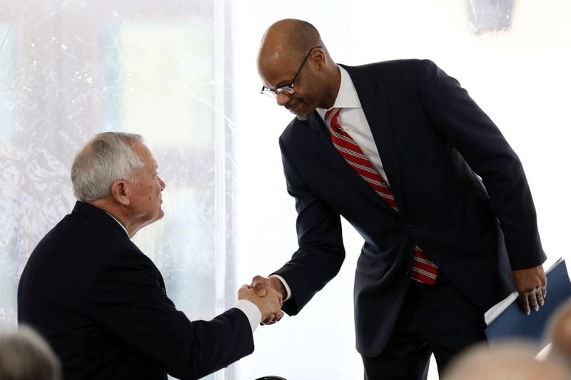 Supreme Court of Georgia Justice Harold Melton (right) shakes the hand of former Georgia Gov. Nathan Deal on Tuesday, Feb. 11, 2020, during the dedication of the new Nathan Deal Judicial Center in Atlanta. (credit: Miguel Martinez for The Atlanta Journal-Constitution)