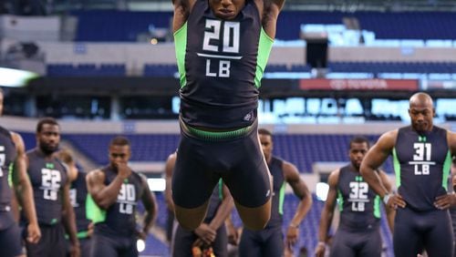 Ohio State linebacker Darron Lee performs a drill at the NFL football scouting combine Sunday, Feb. 28, 2016, in Indianapolis. (AP Photo/Gregory Payan)