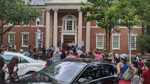 Decatur residents at a city hall rally on Friday May 29, 2020 that was provoked by a student’s racist video. TY TAGAMI / AJC