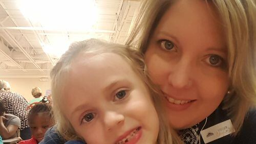 Cheryl Smith with her daughter Emily, whom she adopted after acting as her foster parent. Smith and her husband, Jeremy, of Dallas, Ga., became foster parents after hearing about the opioid epidemic and the need for more foster parents. CONTRIBUTED