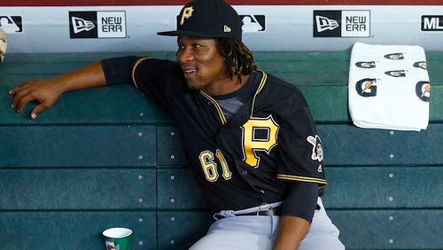 In this May 12, 2017 file photo, Pittsburgh Pirates' Gift Ngoepe, of South Africa, sits in the dugout prior to a baseball game against the Arizona Diamondbacks in Phoenix. Ngoepe made history on April 26, when he became the first African to play Major League Baseball.   (AP Photo/Ross D. Franklin)
