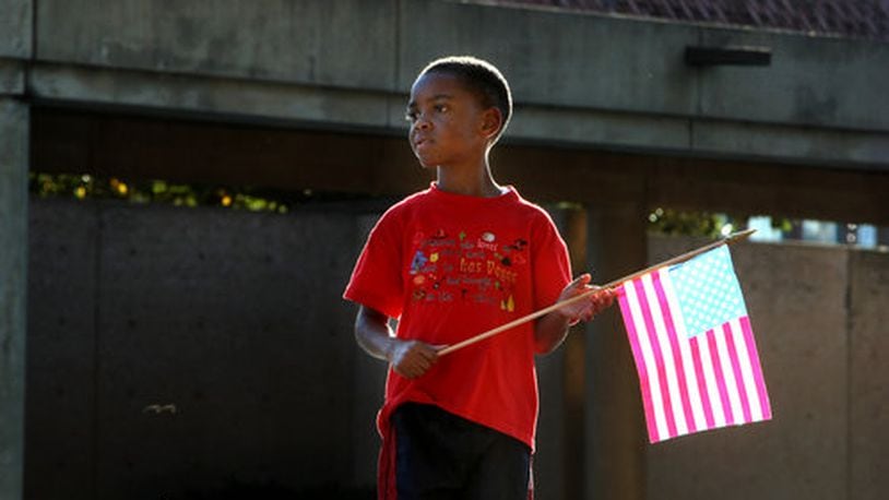 4:01 p.m. Atlanta: Ezekiel Thompson, 5, brought an American flag to the crypt of Martin Luther King Jr. and Coretta Scott King on Tuesday.