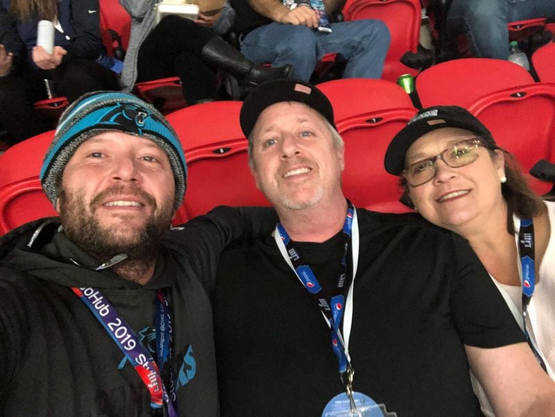 Kent and Laura Fite in their Super Bowl seats, made friends with a Carolina Panthers fan.