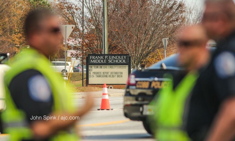 Counselors were at Lindley Middle School in Mableton after students and others witnessed a car hit and kill a well-known crossing guard. JOHN SPINK / JSPINK@AJC.COM