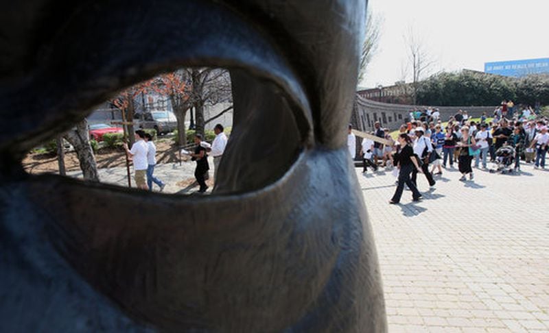 Based on a 12th-century Nigerian tradition, the John Wesley Dobbs sculpture by Ralph Helmick is only a “face mask,” according to the Library of Congress, so passersby can literally look out onto Auburn Avenue “through his eyes.” FILE