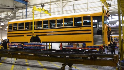 A Blue Bird bus travels down the assembly line at the company headquarters in Fort Valley, Georgia.
