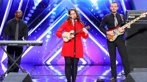 In this undated photo provided by NBC, Mandy Harvey sings during auditions for the show "America's Got Talent" in Pasadena, Calif. Harvey, a deaf singer is moving on to the semifinals of âAmericaâs Got Talentâ after delivering a performance that aired Tuesday, June 6, 2017, that judge Simon Cowell calls âone of the most amazing thingsâ heâs ever seen or heard. Mandy Harvey told the judges on the NBC reality competition that she suffers from a connective tissue disorder and she lost her hearing when she was 18. Now 29, Harvey said she taught herself to sing again using muscle memory and visual tuners. (Trae Patton/NBC via AP)