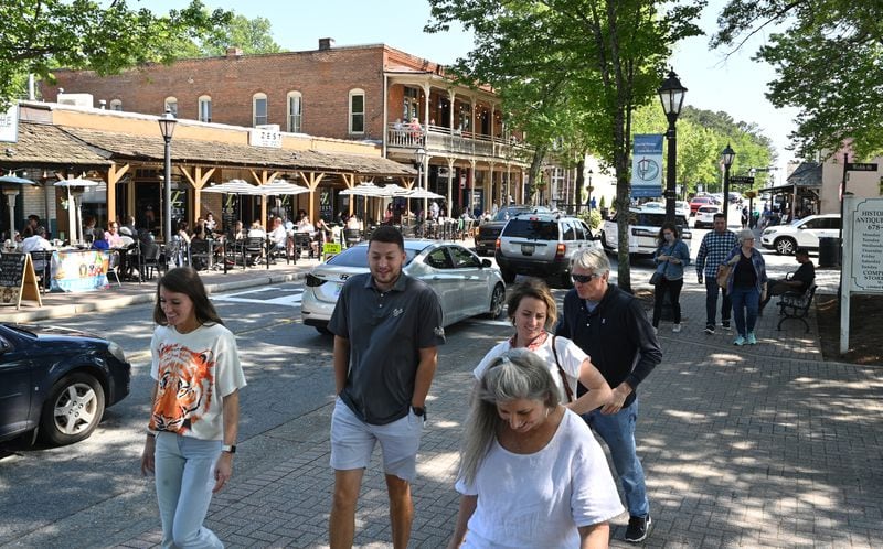 May 8, 2021 Roswell - People walk along Canton street in downtown Roswell on Saturday, May 8, 2021. Roswell is working to manage future development of downtown to the Canton street neighborhood and preserving its historic look, but some business owners question whether changes will add to current problems. (Hyosub Shin / Hyosub.Shin@ajc.com)