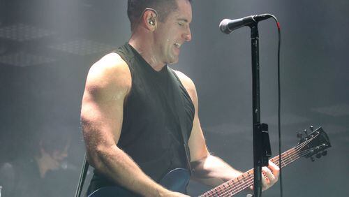 Nine Inch Nails frontman Trent Reznor performing at Philips Arena in 2013. (Akili-Casundria Ramsess/Special to the AJC)