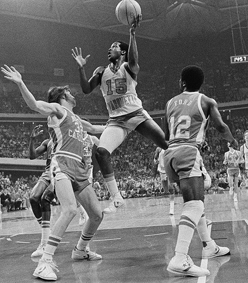 North Carolina's Tom Zaliagiris (32) attempts to stop Marquette's Butch Lee (15) as he goes up high for a score during first period of the NCAA title game March 28, 1977, at the Omni in Atlanta.