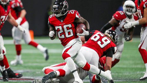 Atlanta Falcons running back Tevin Coleman (26) carries the ball during the second half the game at Mercedes-Benz Stadium in Atlanta, Sunday, December 16, 2018.  The Atlanta Falcons beat the Arizona Cardinals, 40-14. (ALYSSA POINTER/ALYSSA.POINTER@AJC.COM)