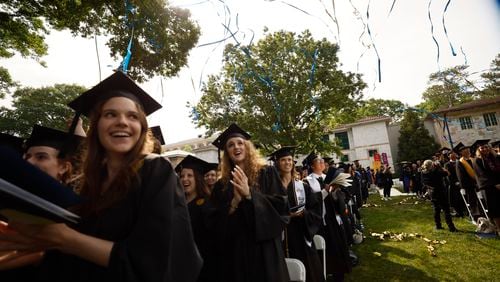 Students toss confetti during Emory University's 178th Commencement ceremony on Monday, May 8, 2023. (Miguel Martinez /miguel.martinezjimenez@ajc.com)