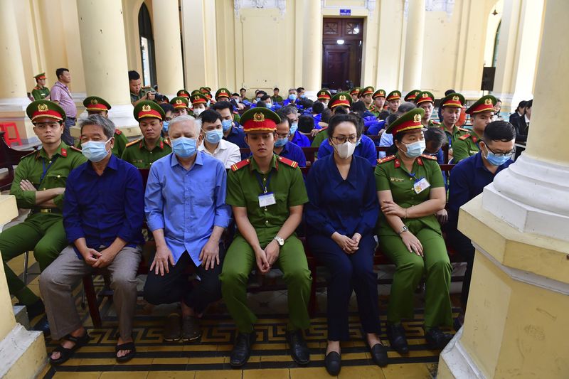 Defendants attend a trial for their involvement in a $12.5 billion fraud case in Ho Chi Minh City, Vietnam on Thursday, April 11, 2024. Businesswoman Truong My Lan may face the death penalty if convicted of allegations that she siphoned off the amount, nearly 3 percent of Vietnam's 2022 GDP, in its largest financial fraud case. (Thanh Tung/ VNExpress via AP).