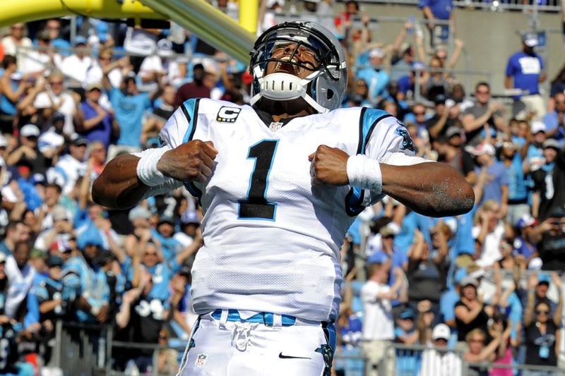 Carolina Panthers' Cam Newton (1) celebrates his touchdown run against the New York Giants during the second half of an NFL football game in Charlotte, N.C., Sunday, Sept. 22, 2013. (AP Photo/Mike McCarn) Carolina quarterback Cam Newton celebrating after scoring a touchdown against the New York Giants last December. (Associated Press)