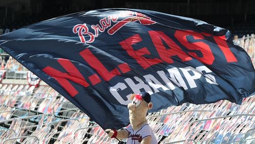 Braves mascot Blooper waved the National League East championship flag while the Braves played the Reds during the NL wild-card playoff series at fan-less Truist Park.