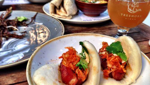 Tyler Williams’ menu takes influences from all over the map, including these steamed pork belly buns. (Wyatt Williams)