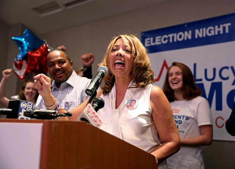 Lucy McBath speaks to supporters during her watch party in Sandy Springs on Tuesday. JASON GETZ/SPECIAL TO THE AJC