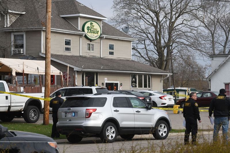 State and local investigators at the scene after three people were reported killed and two wounded in an early morning shooting at The Somers House bar in the village of Somers, Wisconsin. The bar is near Carthage College in Kenosha. (Mark Hertzberg/Zuma Press/TNS)