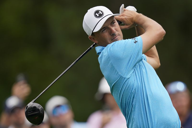 Jordan Spieth watches his tee shot on the third hole during the first round of the Wells Fargo Championship golf tournament at the Quail Hollow Club Thursday, May 9, 2024, in Charlotte, N.C. (AP Photo/Erik Verduzco)