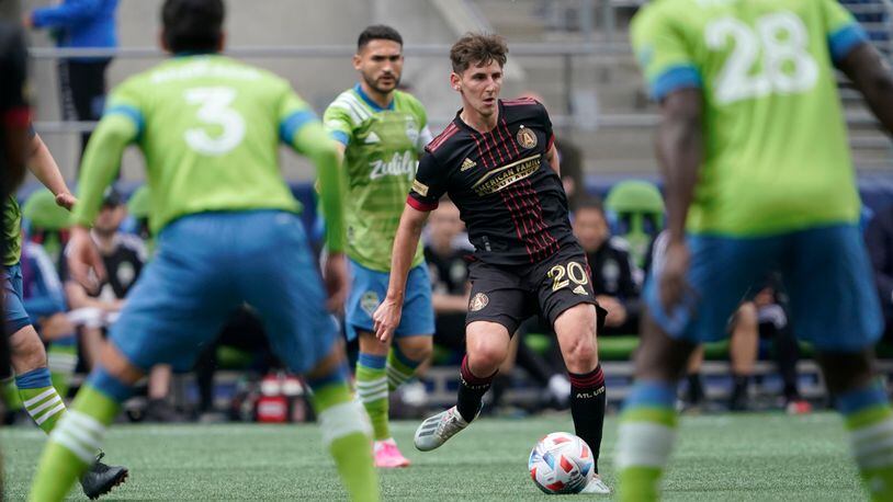 Atlanta United midfielder Emerson Hyndman (20) looks to pass against the Seattle Sounders during the first half Sunday, May 23, 2021, in Seattle. (Ted S. Warren/AP)