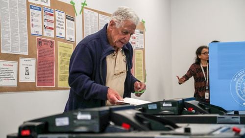 Hartley Falbaum of Loganville casts his ballot during early voting for the presidential primary at the Gwinnett County Voter Registrations and Elections office building in Lawrenceville, Monday, March 2, 2020. (Alyssa Pointer/AJC)