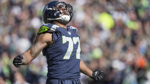 Seattle Seahawks' Michael Bennett exults after a tackle for loss during the first quarter on Sunday, Sept. 27, 2015, at CenturyLink Field in Seattle, Wash. (Dean Rutz/Seattle Times/TNS)