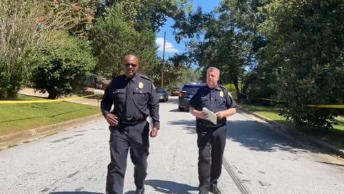 Atlanta police Deputy Chief Charles Hampton (left) and Chief Darin Schierbaum speak at the scene of a deadly shooting in northwest Atlanta on Sunday.