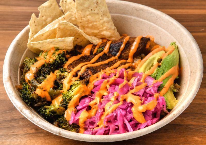 The favorite of owner Mikail Ali is Papi's Bowl (mushroom chorizo, sofrito brown rice, black beans, red pepper crema, plantains, slaw, avocado and roasted veggies). (Chris Hunt for The Atlanta Journal-Constitution)