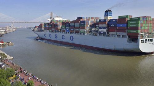 A crowd of well-wishers along River Street welcome the container ship COSCO Development, Thursday morning, May 11, 2017, in Savannah, Ga, as the vessel sails up the Savannah River to the Port of Savannah. The ship is the largest vessel ever to call on the U.S. East Coast. (Steve Bisson/Savannah Morning News via AP)